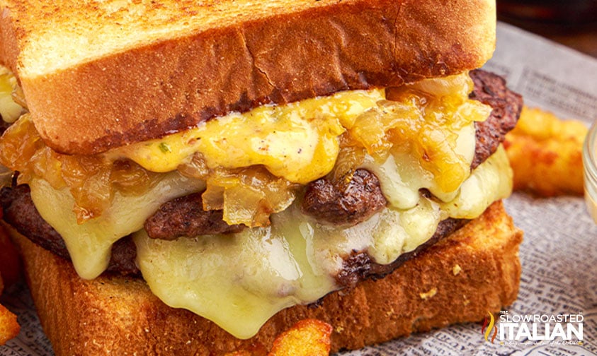 ground beef patties, caramelized onions and melted cheese on Texas toast