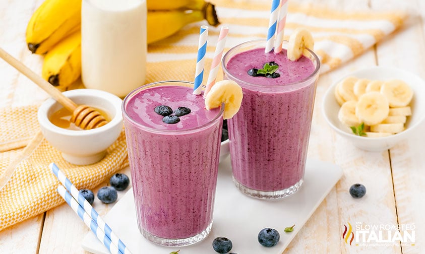 two blueberry breakfast smoothies side by side