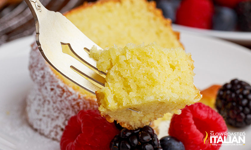 closeup: forkful of cake with fresh berries