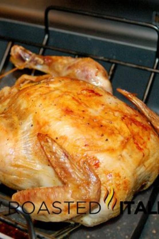baked whole chicken in roasting pan