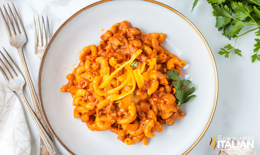 plate of chili mac recipe on table with forks