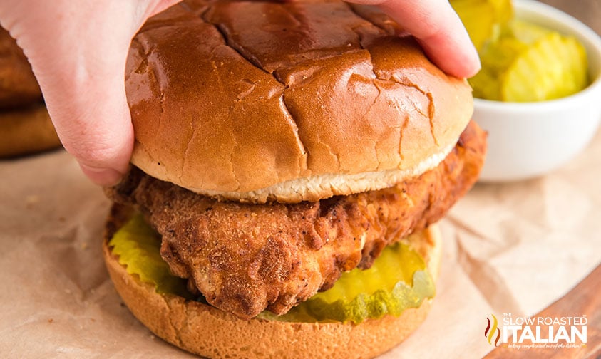 placing top bun onto copycat chick fil a sandwich