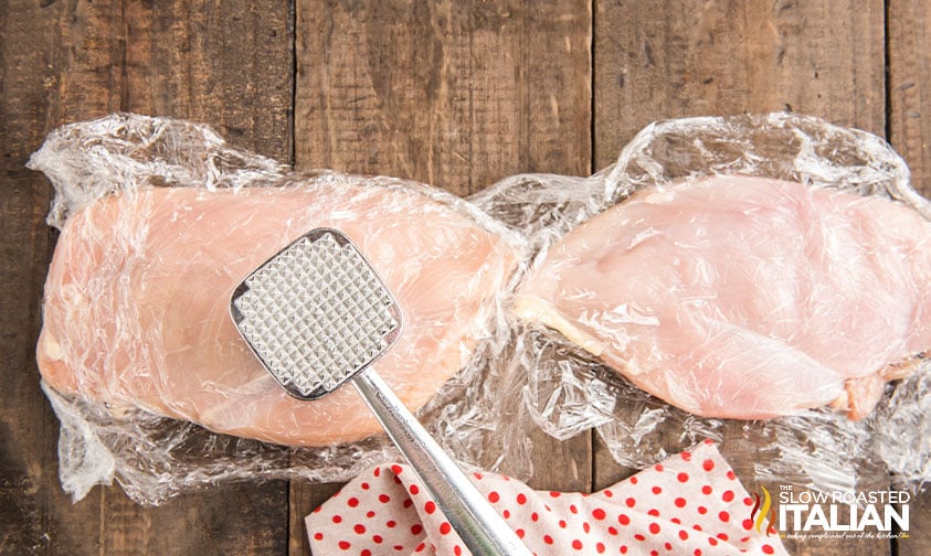 flattening boneless chicken breasts with meat mallet