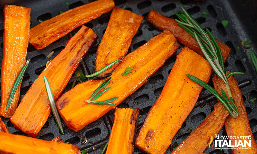 close up of honey glazed carrots in air fryer basket