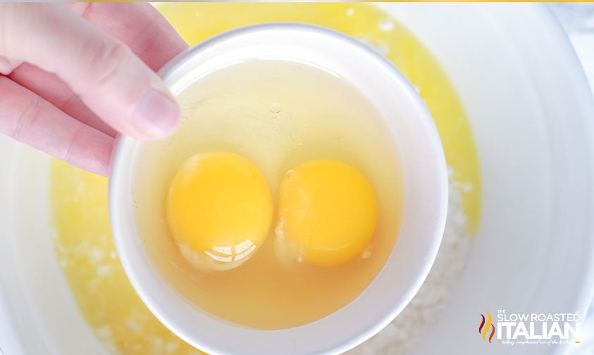 2 eggs in bowl for lemon brownies with lemon glaze