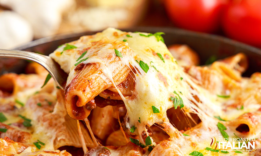 close up of paccheri pasta with ooey gooey cheese