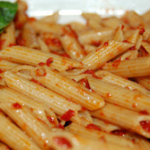 penne smothered with sun dried tomato pesto
