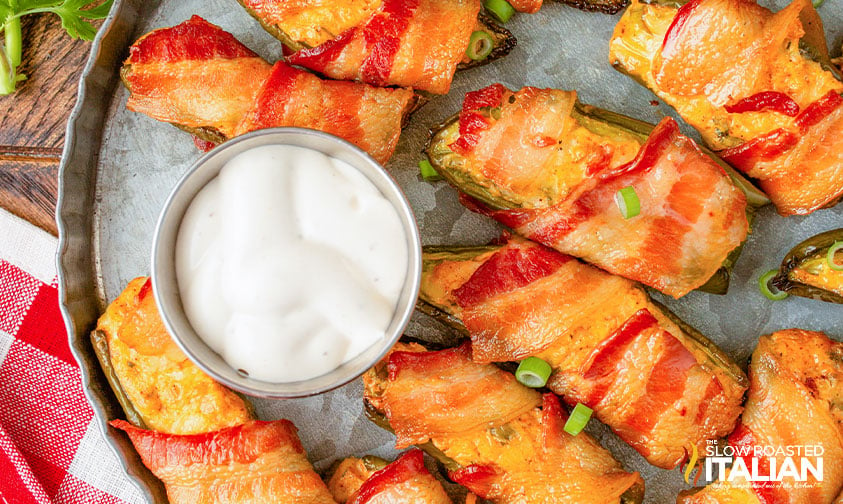 smoked jalapeno poppers on tray with dipping sauce