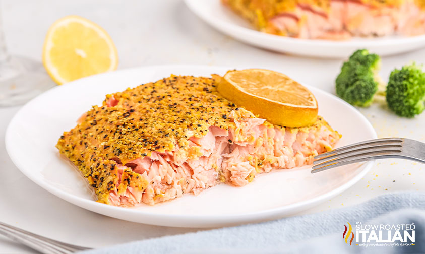 smoked salmon on a plate with lemon slice