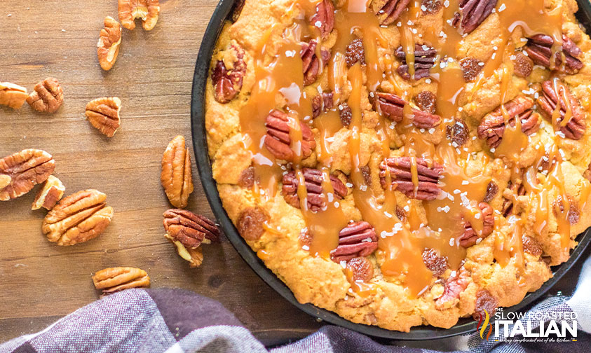 skillet cookie recipe with caramel drizzled on top