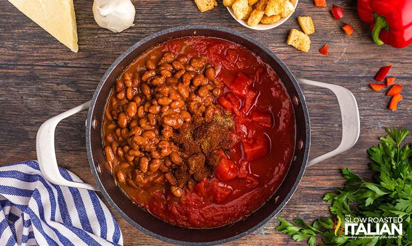 adding beans and spices to pot