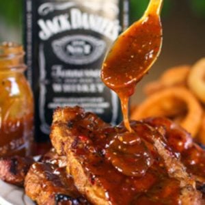 whiskey marinade dripping off a spoon
