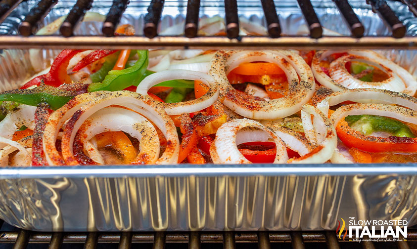 brats in smoker with vegetables.