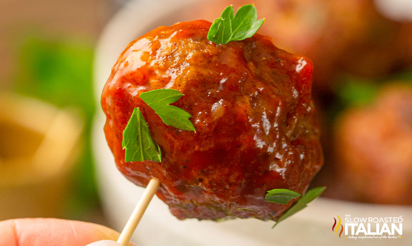 smoked meatball slathered in sauce on a toothpick