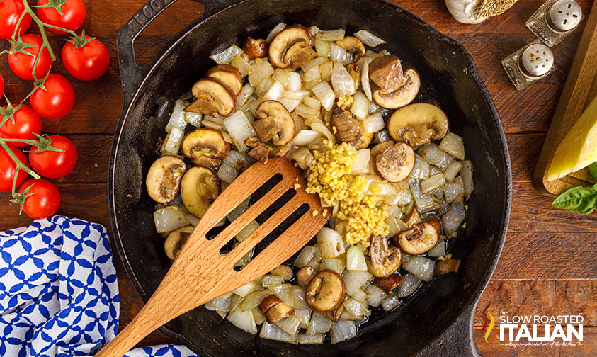 onions, garlic and mushrooms in cast iron skillet
