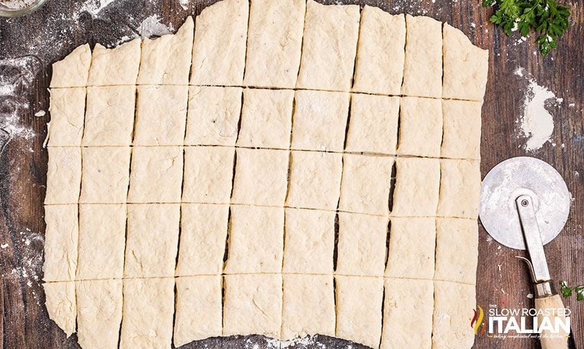 cutting pastry dough for cracker barrel dumplings