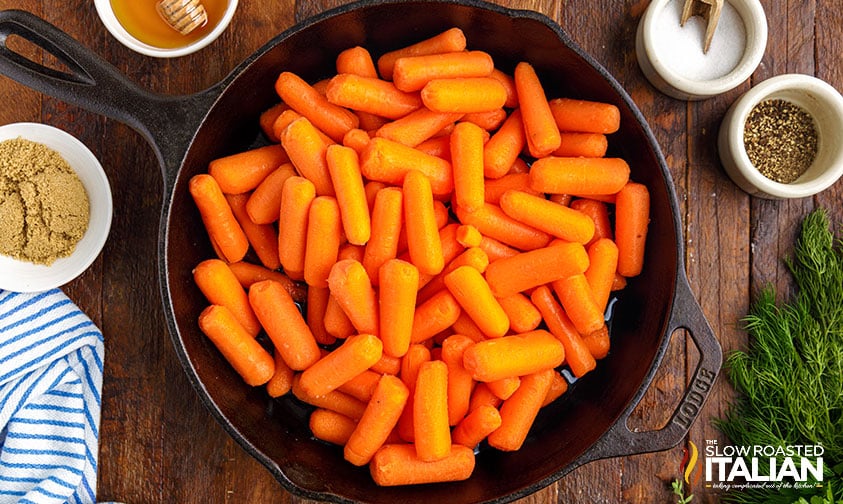 baby carrots in skillet.