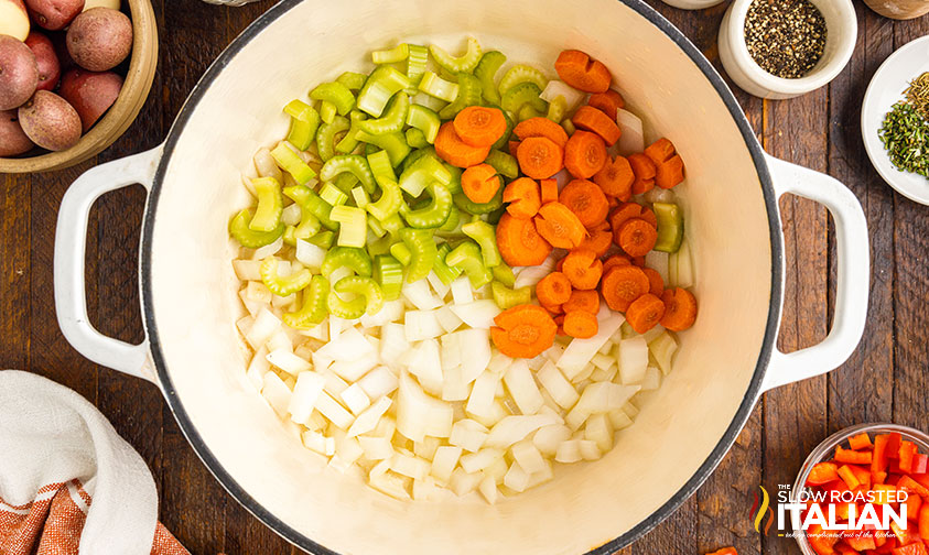 adding veggies to pot.