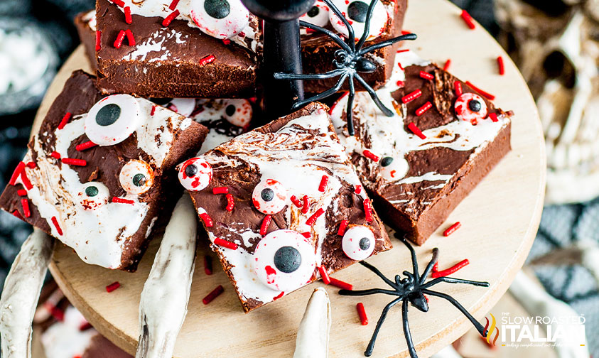 stacked dark chocolate fudge with creepy spiders.