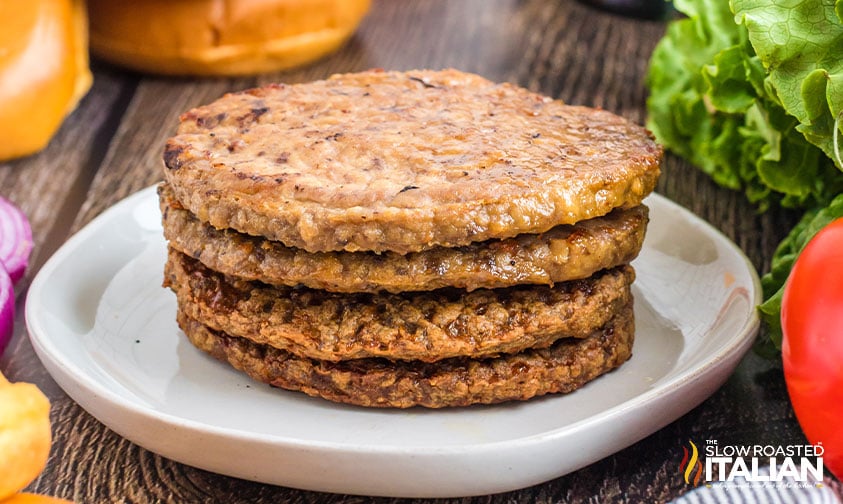 air fried hamburgers stacked on a plate.