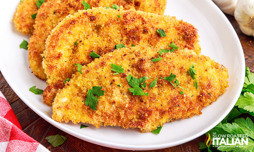 italian chicken cutlets on serving dish
