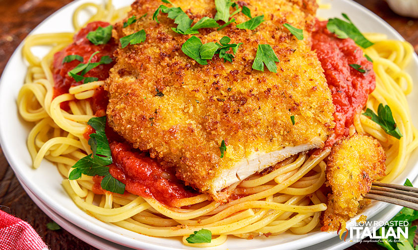 chicken cutlet on plate with pasta