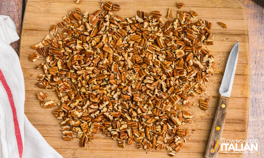 chopped pecans on wood board