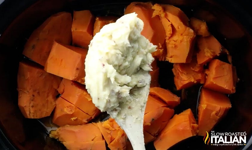 adding butter mixture to cooked sweet potatoes.