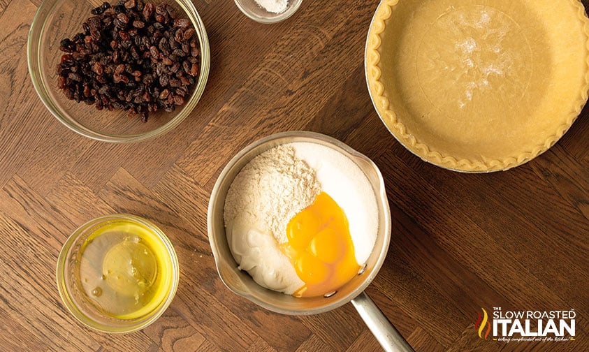 making custard for sour cream raisin pie.