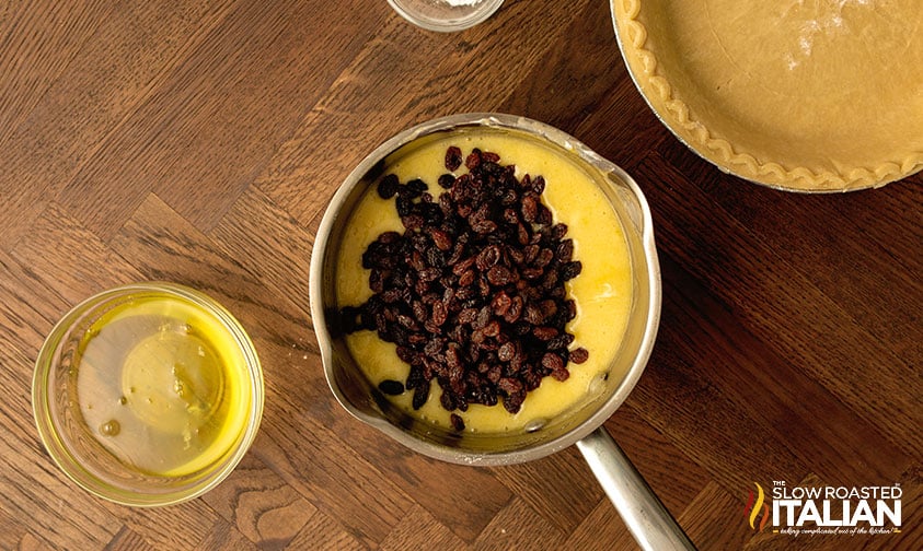 adding raisin to custard.