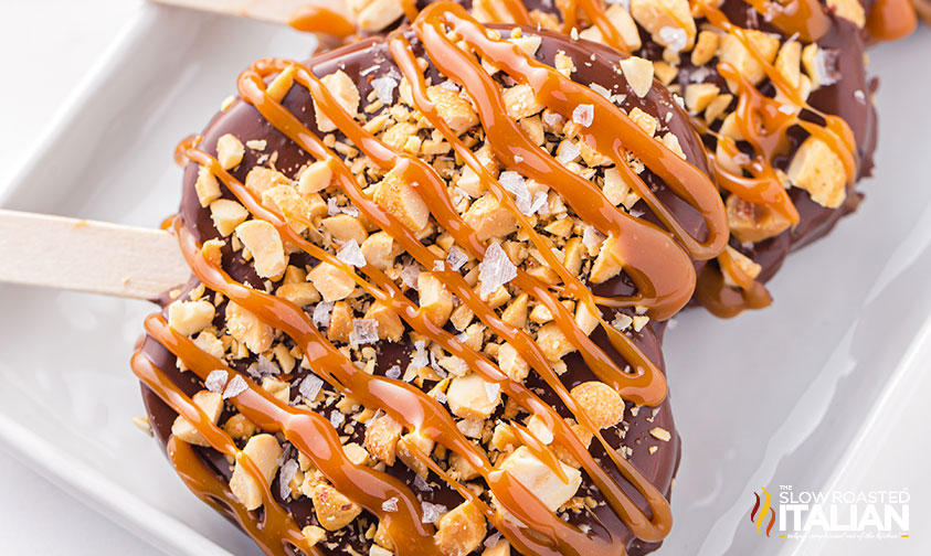 chocolate dipped apples on serving tray.