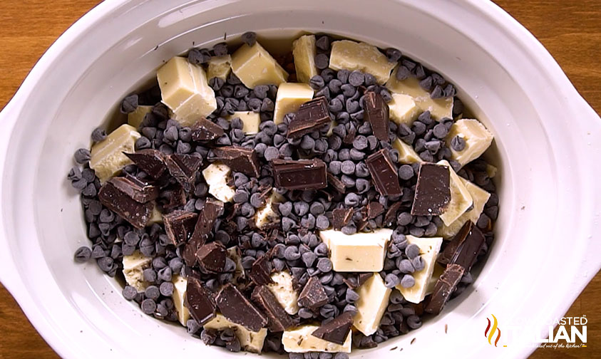 adding chocolate chips to crockpot.