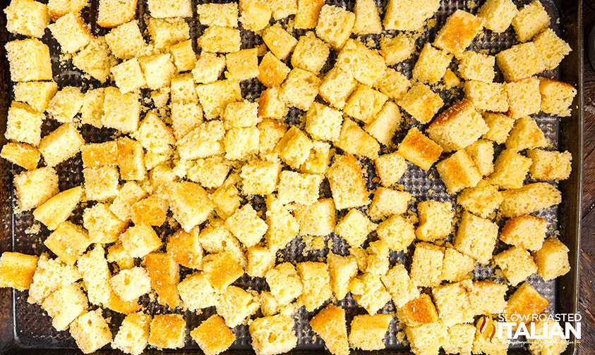 cornbread cubes on baking sheet.