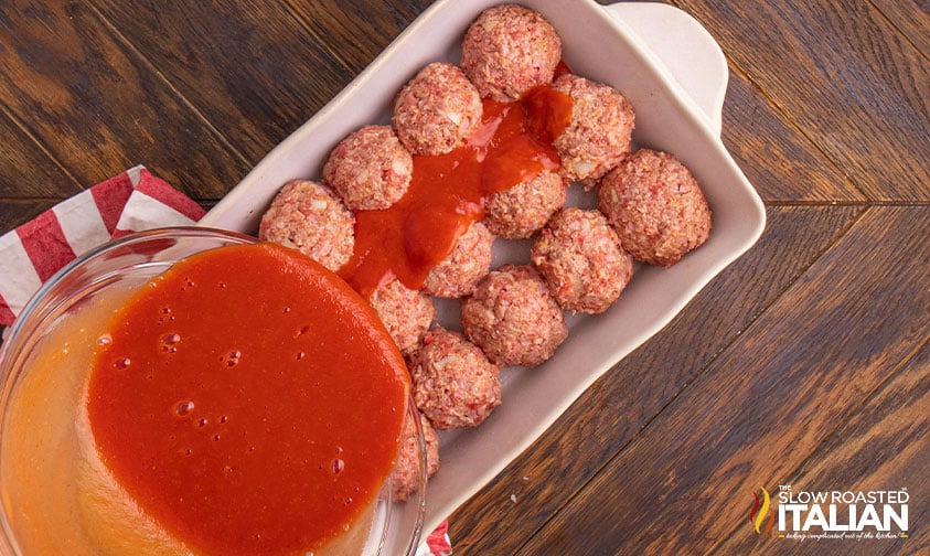 pouring sauce on ham balls.