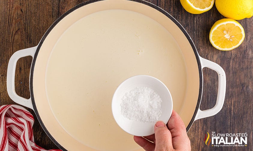 adding salt to dutch oven.