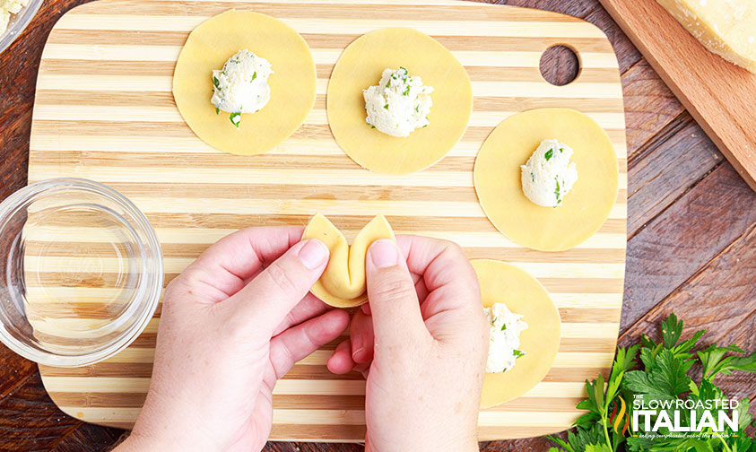 sealing fresh tortellini.