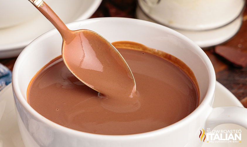 thick hot chocolate in white mug.