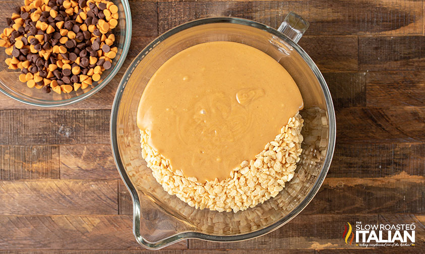 melted peanut butter in bowl with rice krispies.