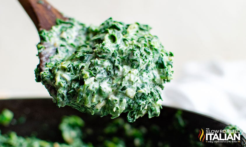 spoon of steakhouse creamed spinach.