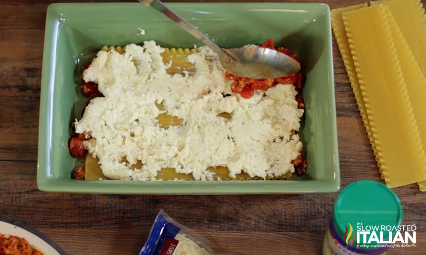 adding filling to lasagna.