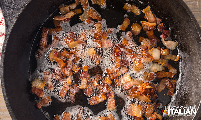 cooking bacon in a skillet.