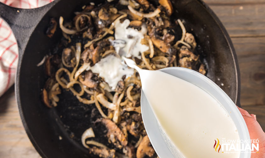 pouring milk into skillet.