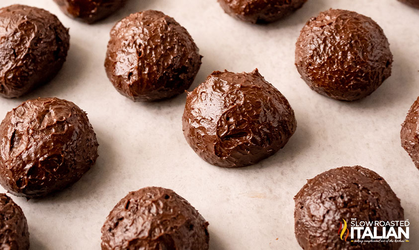 oreo truffles on parchment paper.