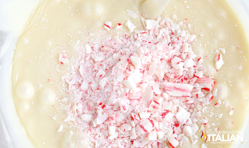 adding crushed candy canes to fudge mixture.