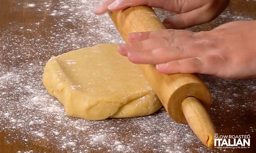 rolling out sugar cookie dough.
