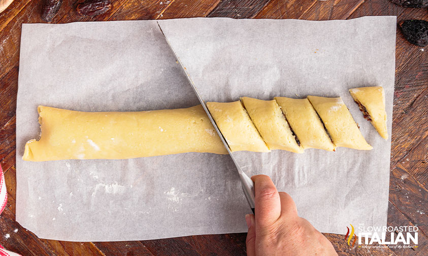 cutting cuccidati cookies.