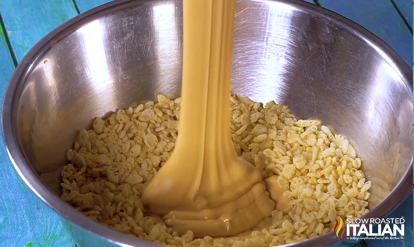 pouring melted peanut butter in rice krispies