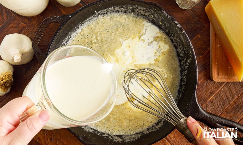 adding cream to sauce