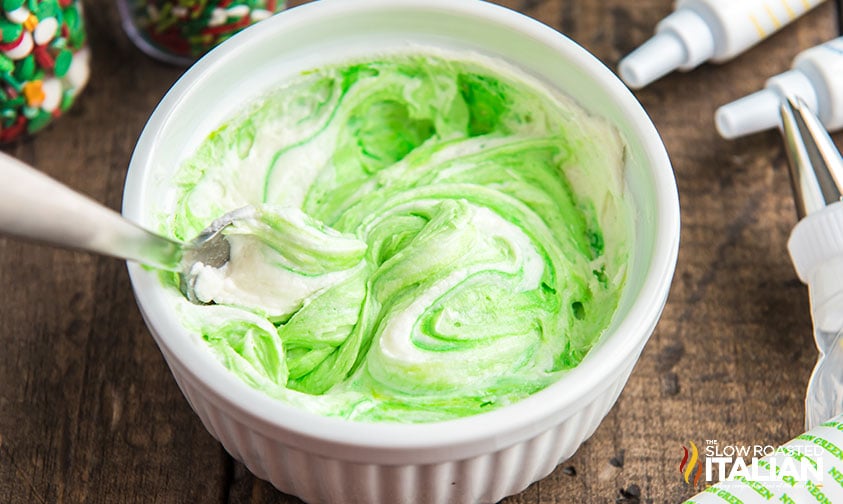 coloring frosting green.