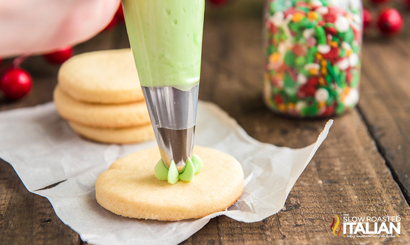 decorating a cookie with frosting.